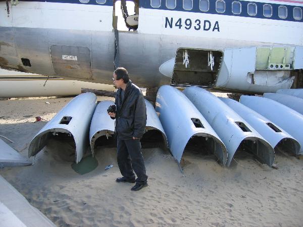 Huang Yong Ping working on Bat Project IV, Aircraft Junkyard, California, 2004, photos by Doryun Chong